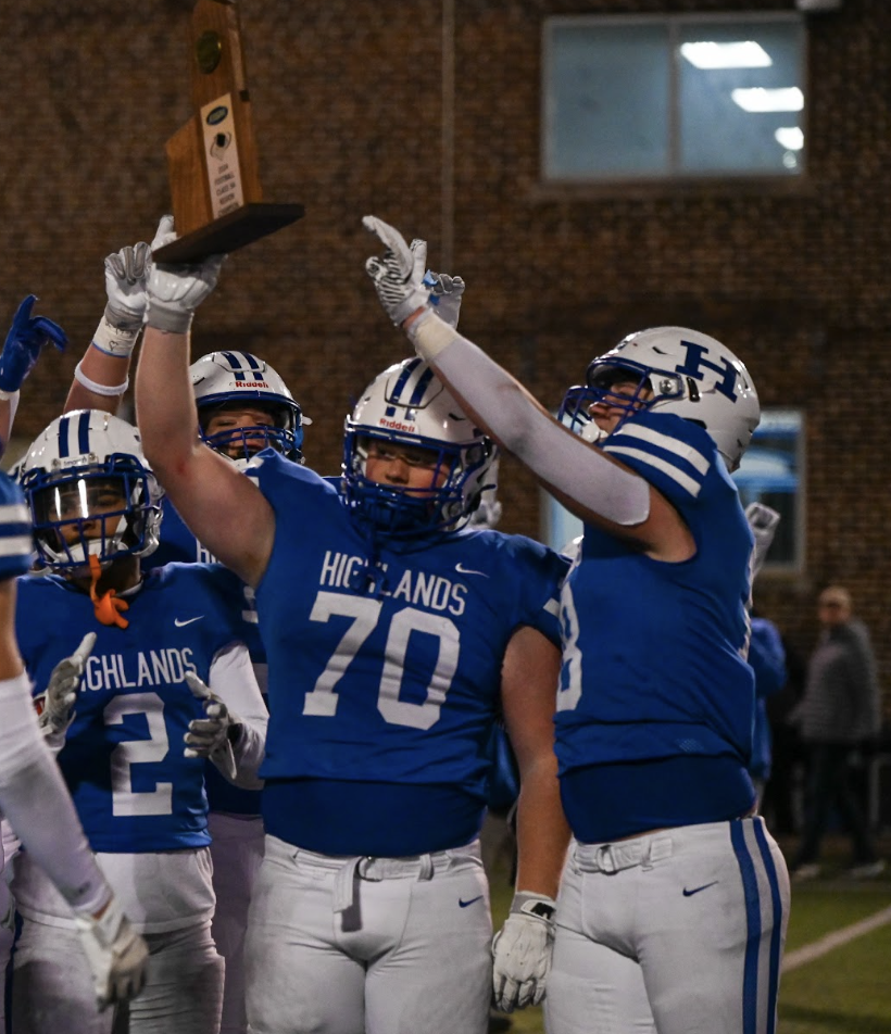 The team captains raise the trophy after their November 22, 2024 win. The team won 42-18 after a rough first few minutes, with Pulaski scoring in the first ten minutes of play. “After we win a game I feel happy about it, but there are always things to fix.” Said number 70 on the varsity team, Torin Bryant.